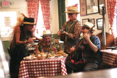 Band sitting at a table